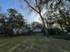 House exterior featuring a stone facade and tropical landscaping at 3663 Lomond Ct, Apopka, FL 32712