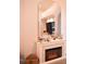 Electric fireplace with a modern mantel and mirror at 3663 Lomond Ct, Apopka, FL 32712