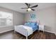 Bright bedroom with a white bed frame and dark hardwood floors at 3756 Idlebrook Cir # 206, Casselberry, FL 32707