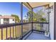 Screened balcony with gray flooring and a view of the community at 3756 Idlebrook Cir # 206, Casselberry, FL 32707