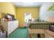 Bright bedroom with painted mural, double closet and green carpet at 405 Kehoe Blvd, Orlando, FL 32825