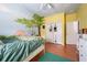 Bedroom with tree mural, double closet and terracotta tile floor at 405 Kehoe Blvd, Orlando, FL 32825