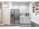 Stainless steel appliances and gray cabinets in this modern kitchen at 405 Kehoe Blvd, Orlando, FL 32825