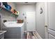 Laundry room with washer, dryer, shelving and utility sink at 405 Kehoe Blvd, Orlando, FL 32825