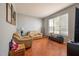 Bright living room with terracotta tile floors, neutral walls, and comfy sofas at 405 Kehoe Blvd, Orlando, FL 32825