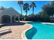 Community pool with a covered seating area and lounge chairs at 4126 Hedge Maple Pl, Winter Springs, FL 32708