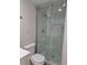 Clean bathroom with a sliding glass shower door and marble-look tile at 4220 Lancashire Ln, Orlando, FL 32812