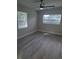 Spacious bedroom featuring light grey walls and wood-look floors at 4220 Lancashire Ln, Orlando, FL 32812