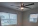 Well-lit bedroom with gray vinyl flooring and ceiling fan at 4220 Lancashire Ln, Orlando, FL 32812