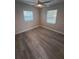 Spacious bedroom with gray vinyl flooring and ceiling fan at 4220 Lancashire Ln, Orlando, FL 32812