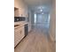 Modern kitchen with white cabinets and gray vinyl flooring at 4220 Lancashire Ln, Orlando, FL 32812