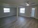 Spacious living room with wood-look floors and plenty of natural light at 4220 Lancashire Ln, Orlando, FL 32812