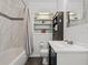 Bathroom with tub, shower, and built-in shelving at 4304 Mizell St, Orlando, FL 32812