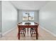 Simple dining area with a wood table and four chairs at 4304 Mizell St, Orlando, FL 32812