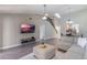 Living area with L-shaped sofa, fireplace and view of staircase at 447 Stanton Pl, Longwood, FL 32779