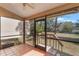 Relaxing screened porch with tile flooring, providing access to backyard at 447 Stanton Pl, Longwood, FL 32779