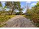 Paved brick pathway meandering through a beautifully landscaped community at 452 Misty Oaks Run, Casselberry, FL 32707