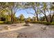 Circular brick patio with benches and statue, creating a tranquil space at 452 Misty Oaks Run, Casselberry, FL 32707