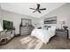 Bright main bedroom with a large bed, gray dresser and plenty of natural light at 452 Misty Oaks Run, Casselberry, FL 32707