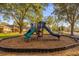 playground with slides and climbing structures in a community park at 452 Misty Oaks Run, Casselberry, FL 32707