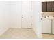 Laundry room with washer, dryer, and additional cabinet storage at 4767 Cragmere Loop, Clermont, FL 34711