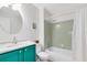 Bathroom with teal vanity and shower/tub combo at 513 Goodridge Ln, Fern Park, FL 32730