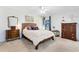 Bedroom with a queen bed, dresser, and window at 513 Goodridge Ln, Fern Park, FL 32730