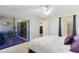 Bedroom with sliding doors to sunroom and en-suite bathroom at 513 Goodridge Ln, Fern Park, FL 32730