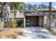 Exterior view of condo with carport and landscaped grounds at 513 Goodridge Ln, Fern Park, FL 32730