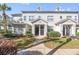 Front view of a two-story townhome with gray siding and walkway at 5159 Wellington Park Cir # 36, Orlando, FL 32839