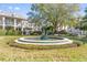 Charming community fountain with lush landscaping at 5159 Wellington Park Cir # 36, Orlando, FL 32839