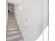 Indoor view of carpeted staircase with white walls and railing at 5159 Wellington Park Cir # 36, Orlando, FL 32839