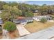 Aerial view of a single-Gathering home with a large backyard and surrounding neighborhood at 5216 Bonnie Brae Cir, Orlando, FL 32808