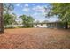 Large backyard with mature trees and open space at 5216 Bonnie Brae Cir, Orlando, FL 32808