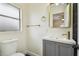 Updated bathroom with a gray vanity and gold fixtures at 5216 Bonnie Brae Cir, Orlando, FL 32808