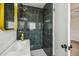 Updated bathroom with dark tile shower and gold fixtures at 5216 Bonnie Brae Cir, Orlando, FL 32808