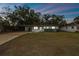 Single story house with carport and well maintained lawn at 5216 Bonnie Brae Cir, Orlando, FL 32808