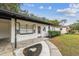 Charming single story home with a covered porch and well-manicured landscaping at 5216 Bonnie Brae Cir, Orlando, FL 32808