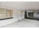 Screened porch with concrete floor and exterior door at 5216 Bonnie Brae Cir, Orlando, FL 32808