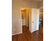 Large bedroom closet with double doors and wood floors at 5550 E Michigan St # 2223, Orlando, FL 32822