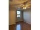 Spacious bedroom with wood floors and ceiling fan at 5550 E Michigan St # 2223, Orlando, FL 32822