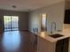 Open kitchen with white quartz countertop and island at 5550 E Michigan St # 2223, Orlando, FL 32822