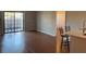 Open living room and kitchen with wood floors at 5550 E Michigan St # 2223, Orlando, FL 32822