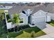 Aerial front elevation of a well-maintained single-Gathering home with landscaped yard at 558 Pawnee Ct, Haines City, FL 33844