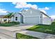 Street view of a single Gathering home featuring a well-kept front lawn at 558 Pawnee Ct, Haines City, FL 33844