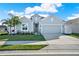 Charming single-story home featuring a well-manicured lawn and two-car garage at 558 Pawnee Ct, Haines City, FL 33844