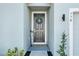 Welcoming front door adorned with a wreath, inviting guests into the home at 558 Pawnee Ct, Haines City, FL 33844