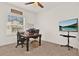 Dedicated home office space with a large desk, monitor, and a view of the backyard at 558 Pawnee Ct, Haines City, FL 33844