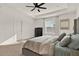 Bright main bedroom with a neutral color palette, large window, and en-suite bathroom at 558 Pawnee Ct, Haines City, FL 33844