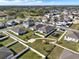 Aerial view of a Gathering-friendly neighborhood featuring green spaces and sidewalks at 558 Pawnee Ct, Haines City, FL 33844